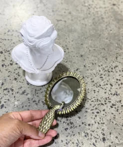 Scout House Timeless Aged Handheld Peacock Mirror. Gifts