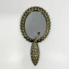 Scout House Timeless Aged Handheld Peacock Mirror. Gifts